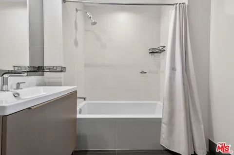 a bathroom with a bathtub and a sink