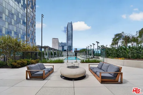 a view of a terrace with couches and potted plants