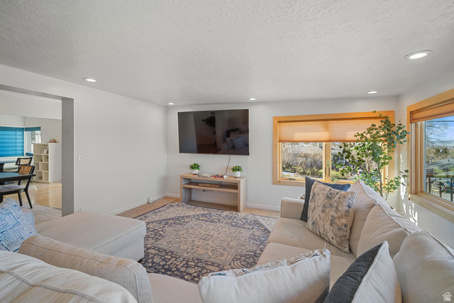 4426 South 3035 East Holladay, UT 84124 - Photo 14 of 49 Living room with a textured ceiling and recessed lighting