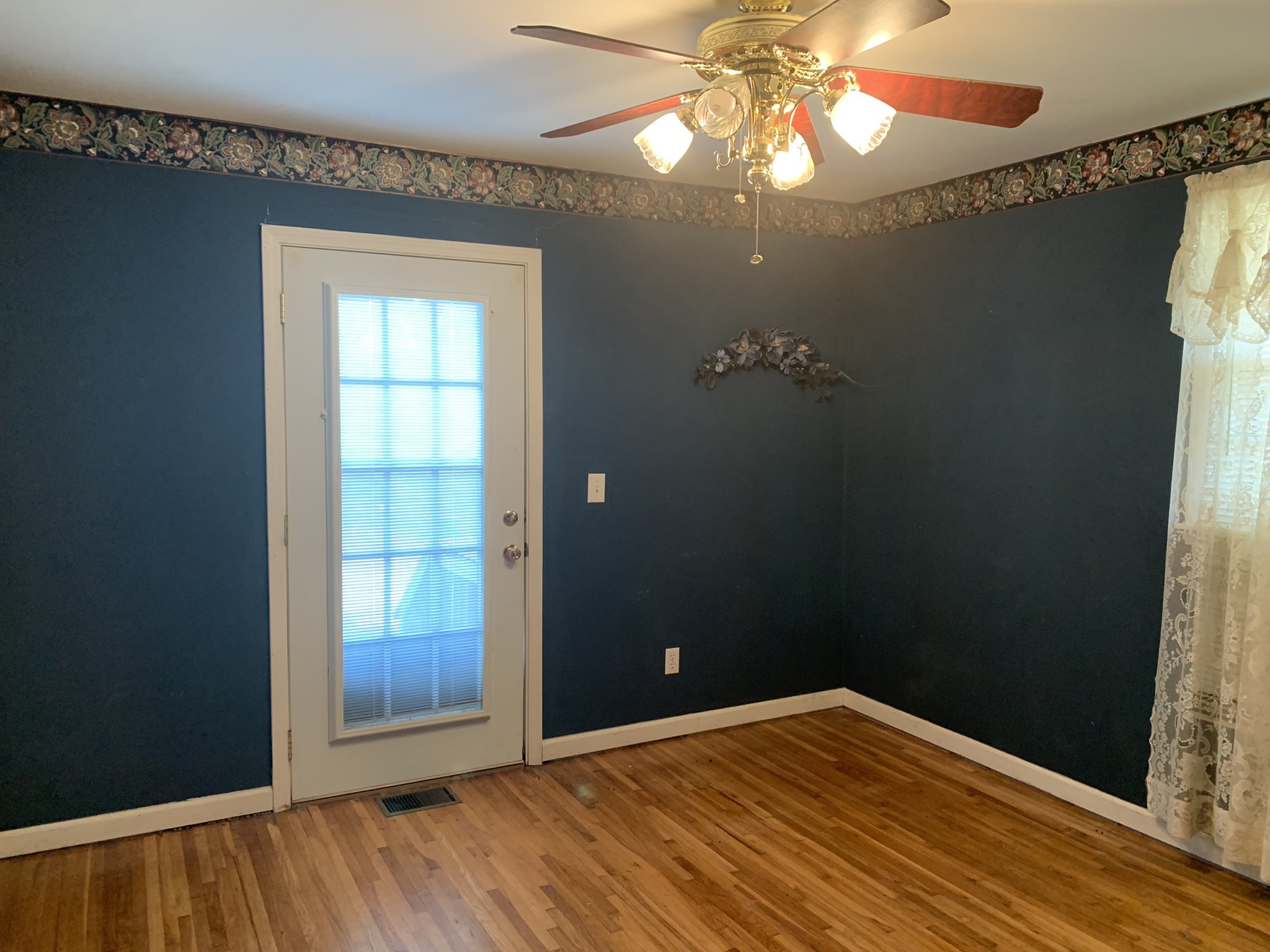 454 Canoe Branch Road Castalian Springs, TN 37031 - Photo 2 of 40 a view of empty room with window and wooden floor