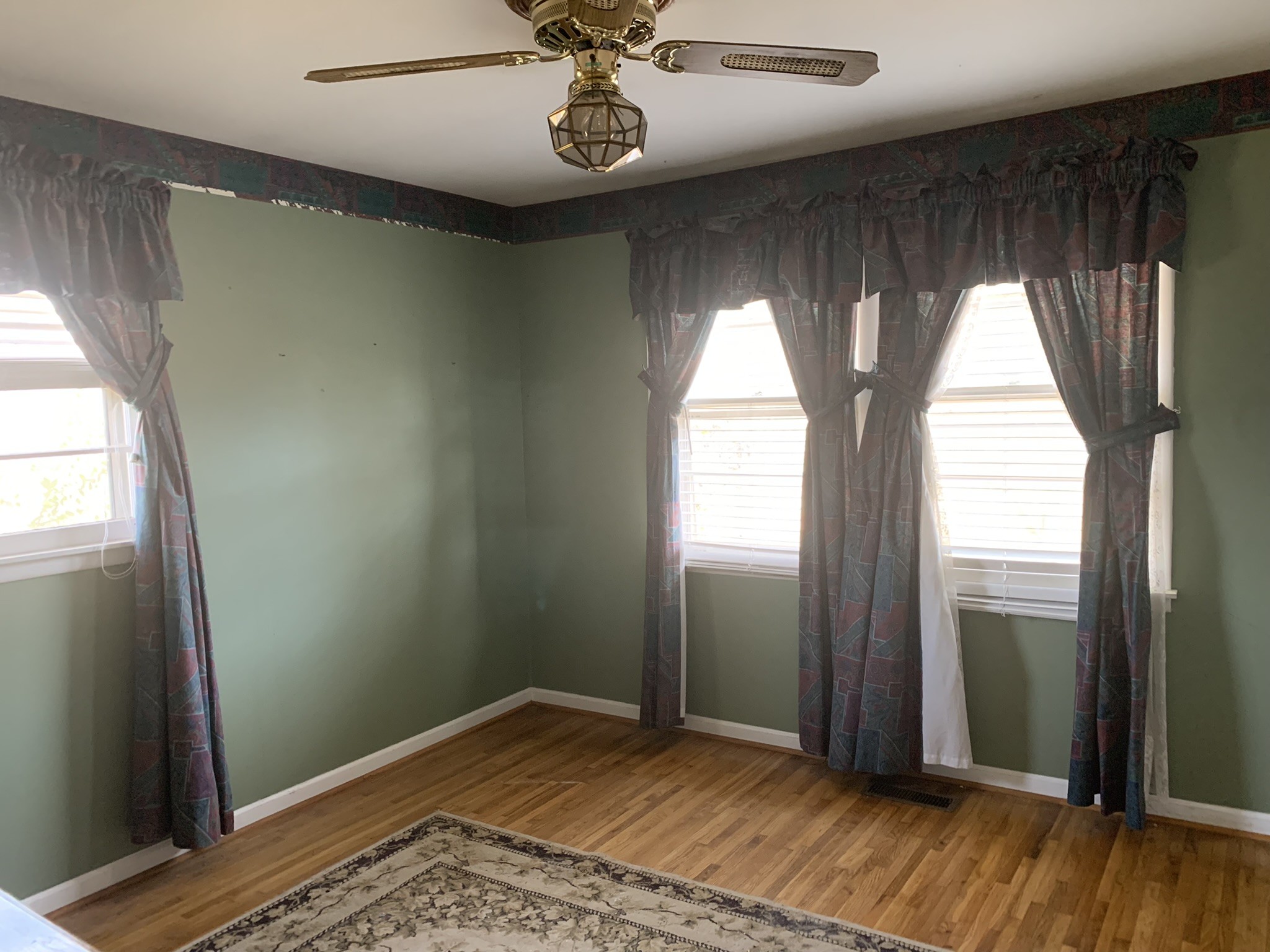454 Canoe Branch Road Castalian Springs, TN 37031 - Photo 4 of 40 wooden floor in an empty room with a window