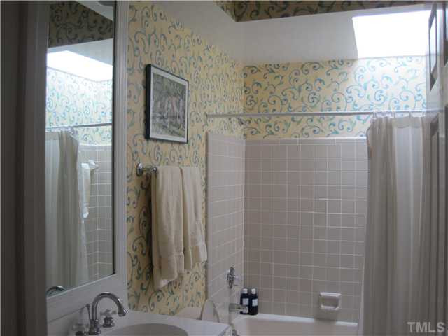 1612 Oberlin Road, Unit 5 Raleigh, NC 27608 - Photo 19 of 25 Guest Bathroom has skylight addition for beautiful natural light. Bathroom