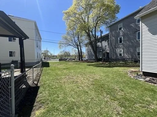 a view of a backyard of the house