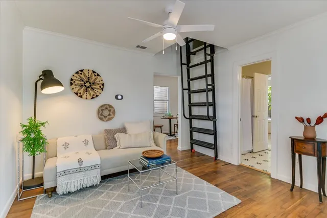 a view of a livingroom with furniture and wooden floor