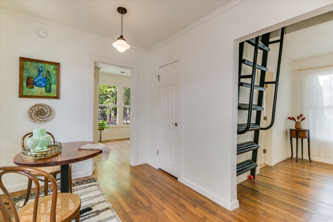 1110 West 22nd Street, Unit 16 Austin, TX 78705 - Photo 11 of 21 a view of a dining room with furniture and wooden floor