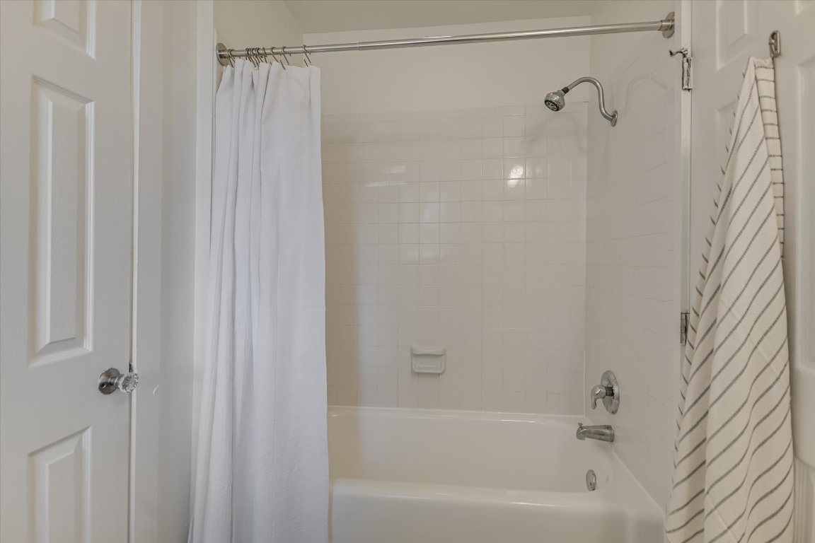 1110 West 22nd Street, Unit 16 Austin, TX 78705 - Photo 15 of 21 a bathroom with a shower and a bath tub