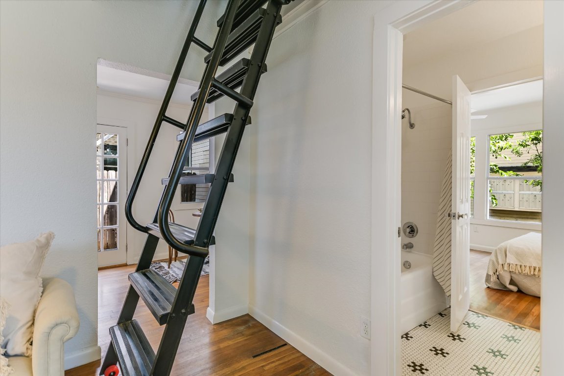 1110 West 22nd Street, Unit 16 Austin, TX 78705 - Photo 17 of 21 a view of a hallway with wooden floor and entryway
