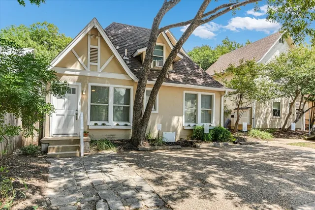a kitchen with a stove and a table chair