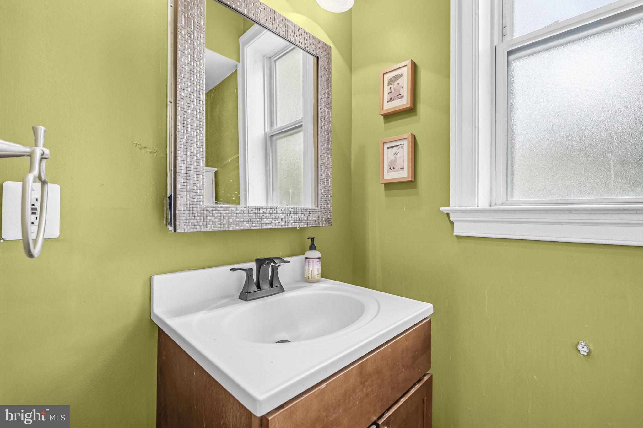 1824 3rd Street Northeast Washington, DC 20002 - Photo 6 of 30 Charming green-hued bathroom oasis.