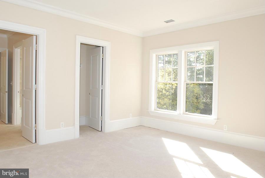 8539 Howell Road Bethesda, MD 20817 - Photo 16 of 22 a view of an empty room with a window