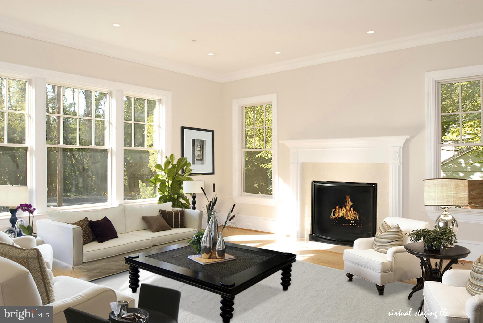 8539 Howell Road Bethesda, MD 20817 - Photo 4 of 22 a living room with furniture and a fireplace