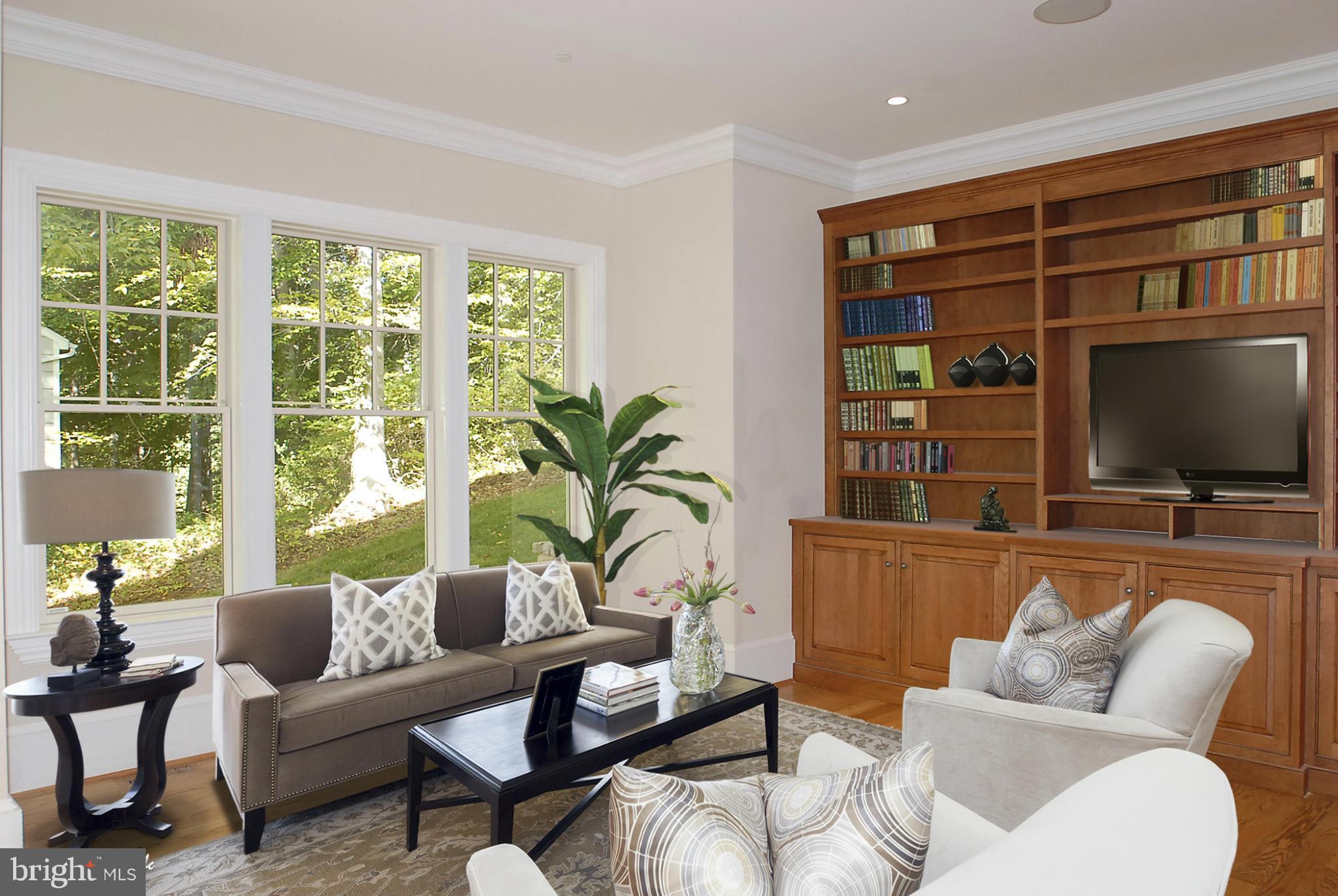 8539 Howell Road Bethesda, MD 20817 - Photo 6 of 22 a living room with furniture and a flat screen tv