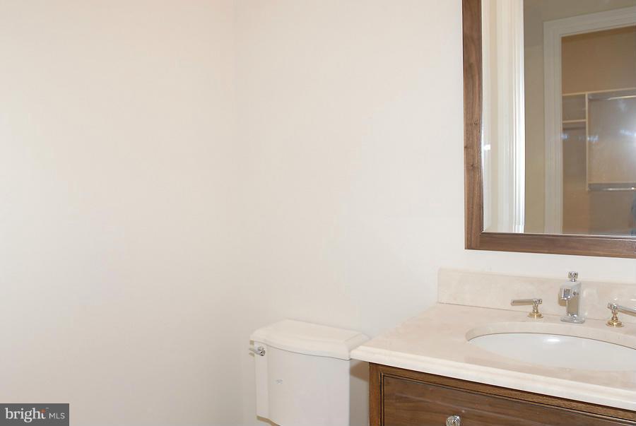 8539 Howell Road Bethesda, MD 20817 - Photo 10 of 22 a bathroom with a sink and a vanity