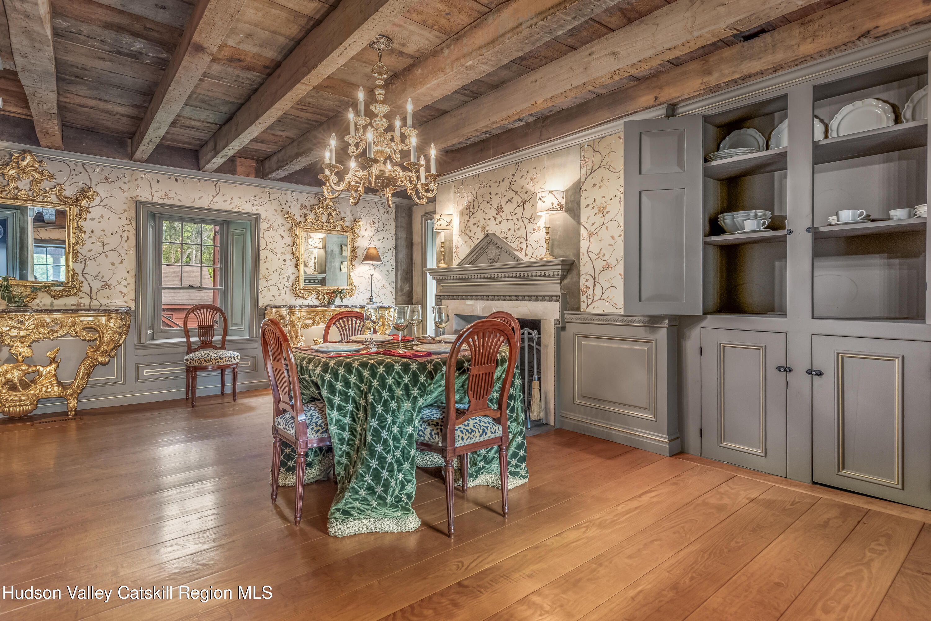 1282 Old Post Road New Paltz, NY 12561 - Photo 14 of 49 a dining room with furniture a chandelier and wooden floor
