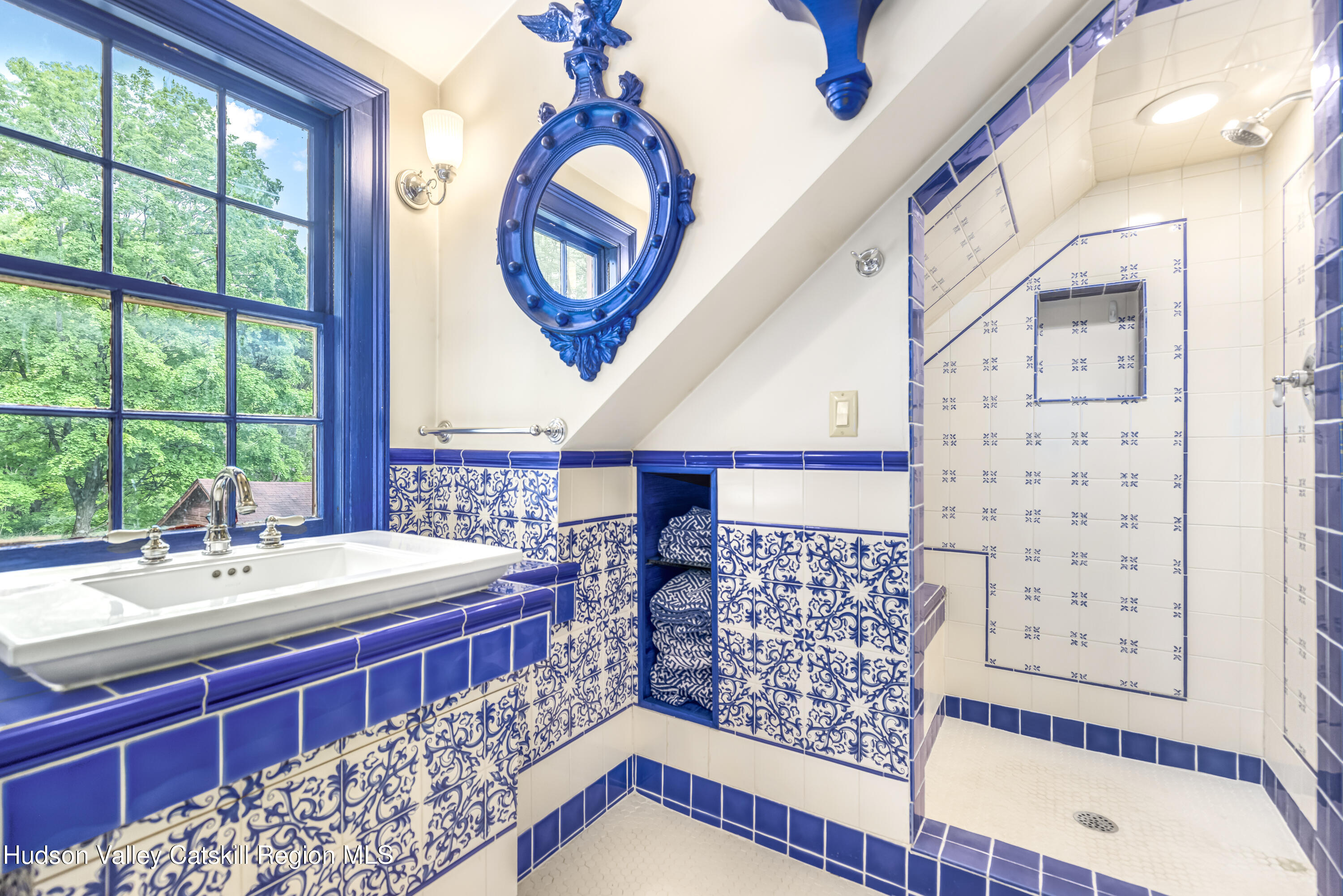 1282 Old Post Road New Paltz, NY 12561 - Photo 41 of 49 a bathroom with a sink a mirror and a window