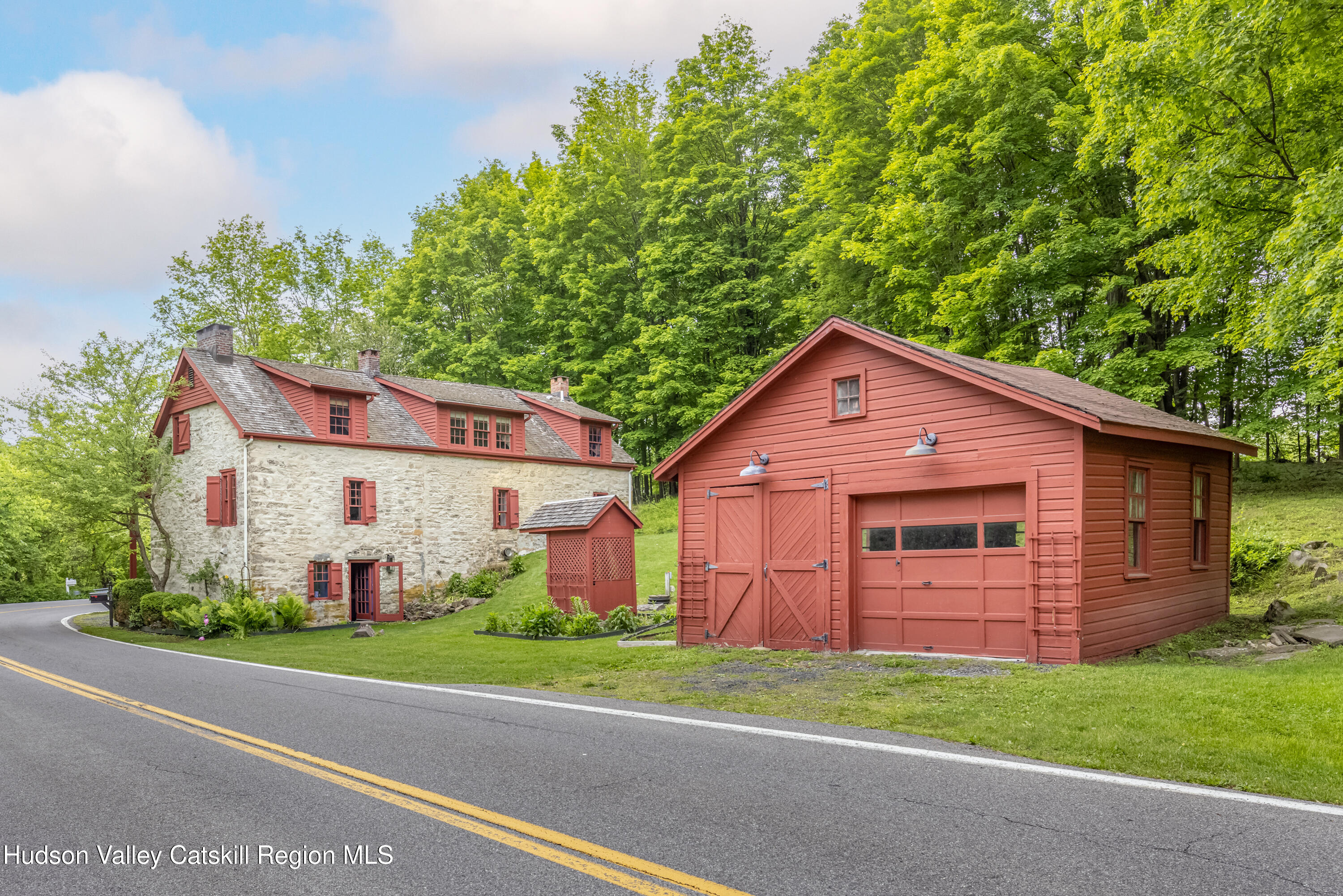 1282 Old Post Road New Paltz, NY 12561 - Photo 48 of 49 a view of a yard in front of a house with plants and large tree