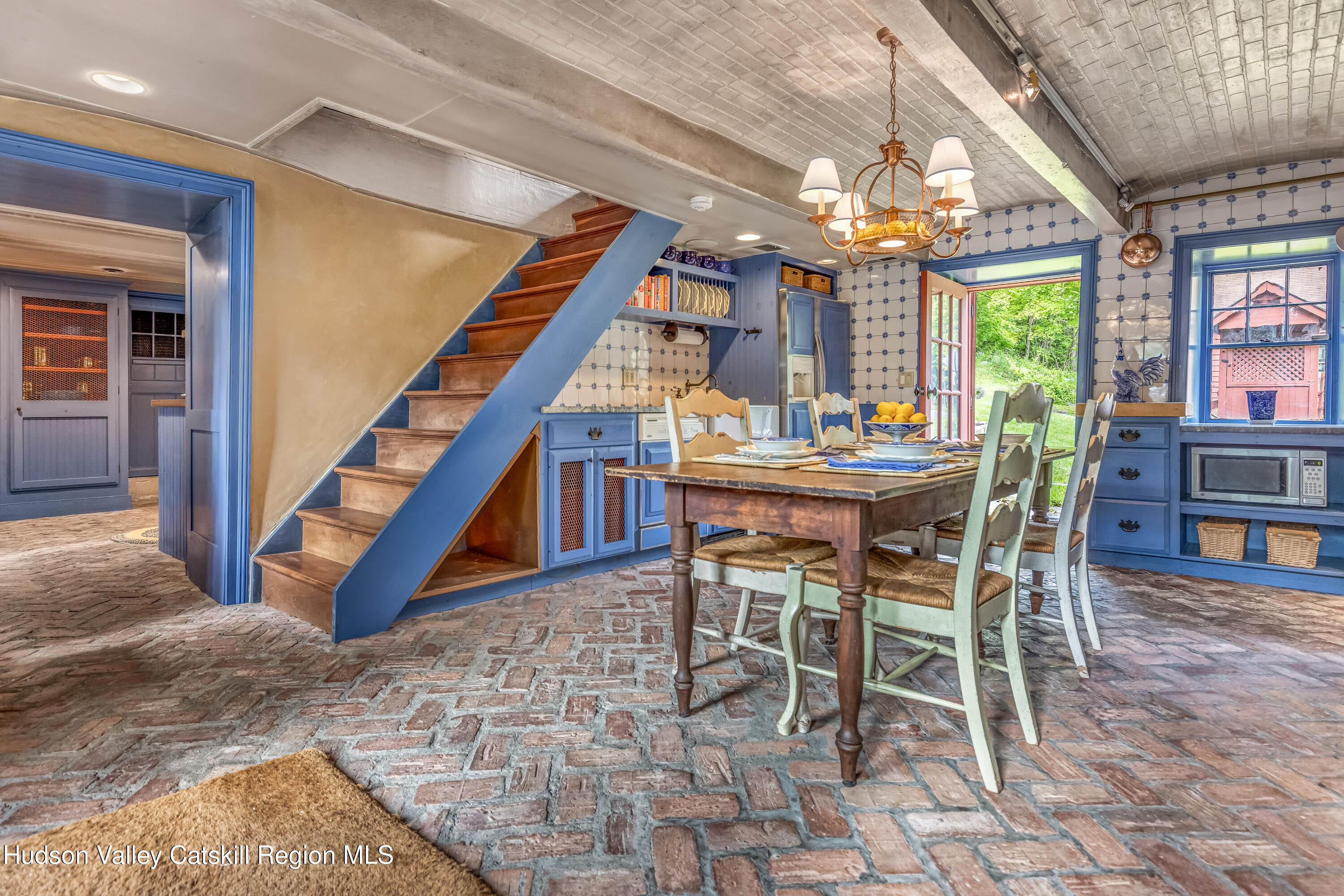 1282 Old Post Road New Paltz, NY 12561 - Photo 9 of 49 a dining room with furniture a chandelier and a rug