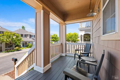 a view of a balcony with chairs