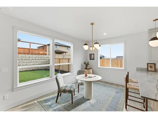 a view of a dining room with furniture window and outside view