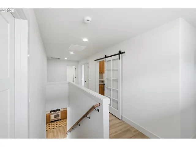 a kitchen with kitchen island a sink appliances and a counter top space