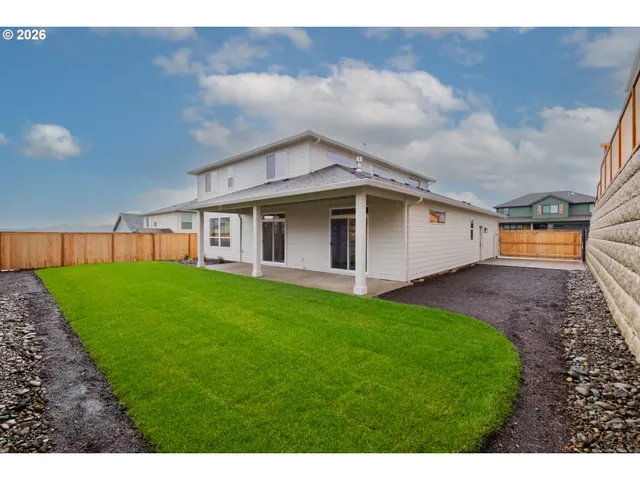 a backyard of a house with lots of green space
