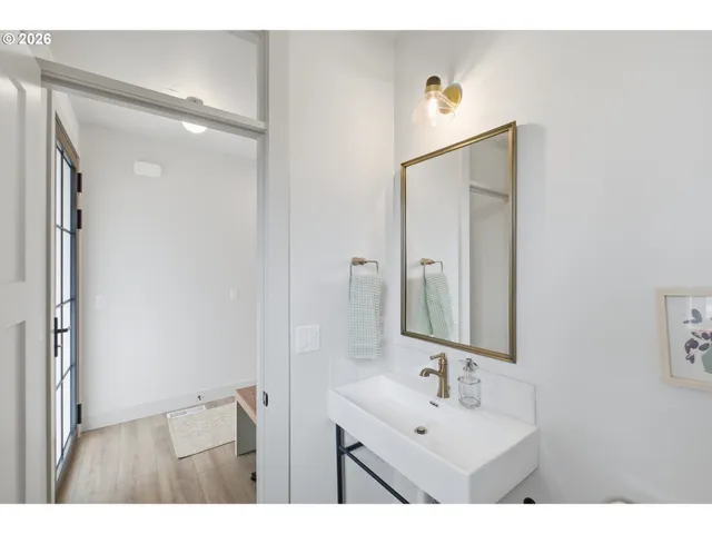 a bathroom with a sink vanity and a mirror