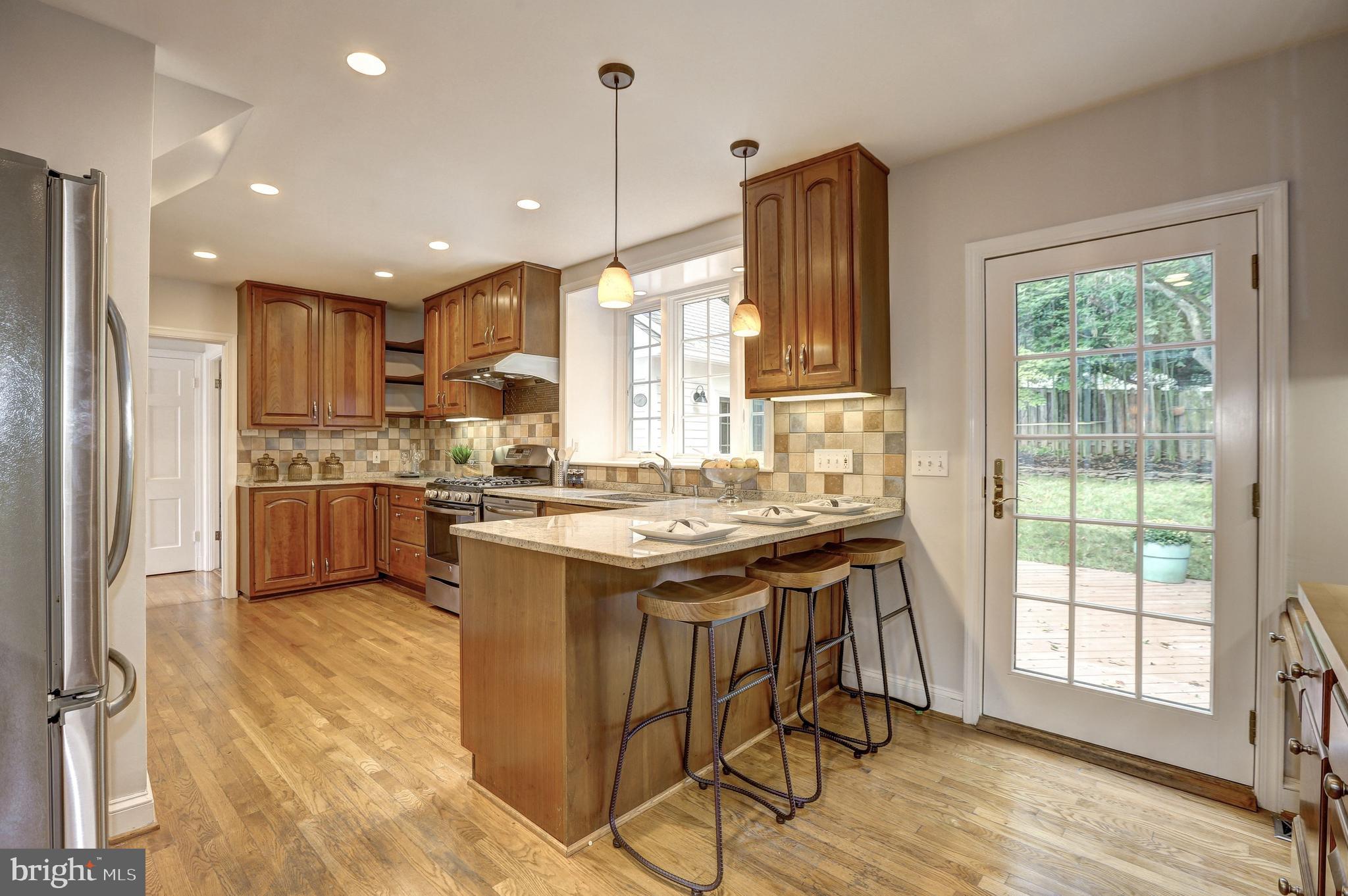 8002 Custer Road Bethesda, MD 20814 - Photo 12 of 32 Ample cabinetry & walkout to deck