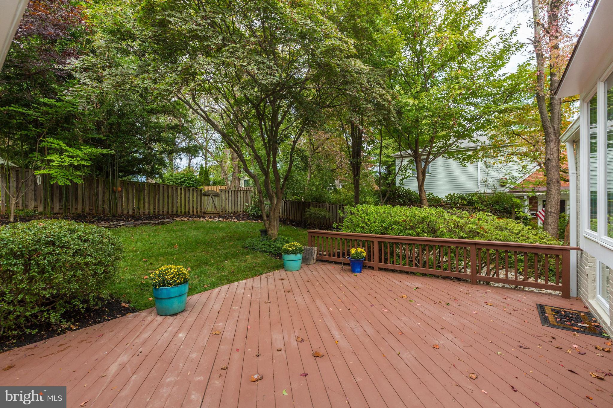 8002 Custer Road Bethesda, MD 20814 - Photo 16 of 32 Walkout from Master Bedroom and Kitchen to deck an
