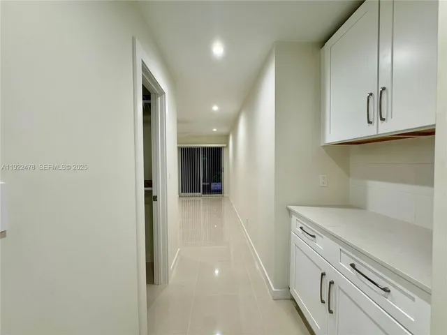 a view of a hallway with storage