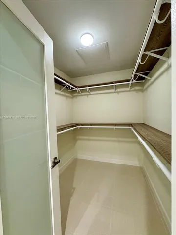 a view of an empty walk in closet