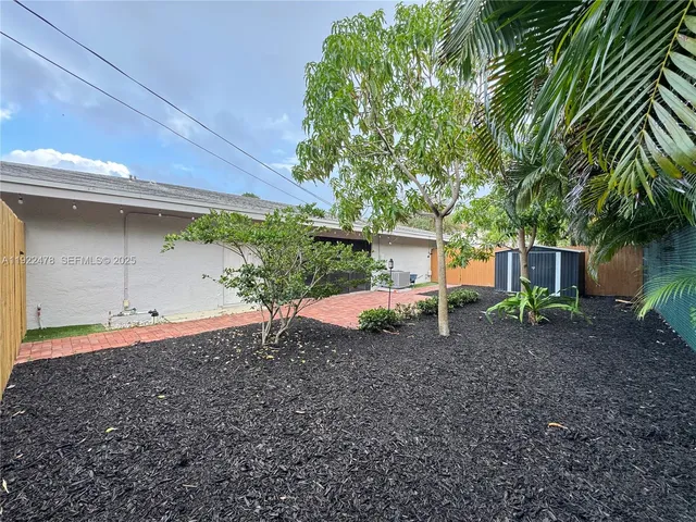 a backyard of a house with lots of green space