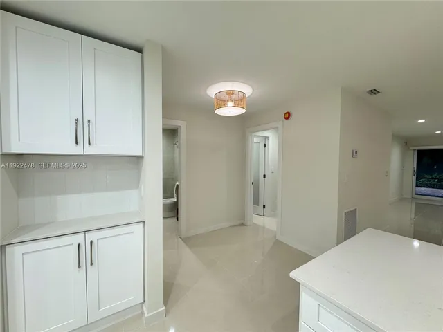 a view of kitchen and utility room