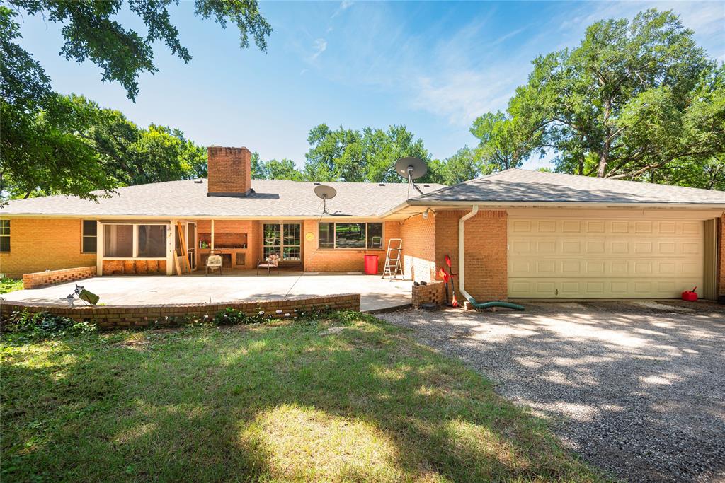 10289 County Road 578 Blue Ridge, TX 75424 - Photo 32 of 39 a front view of a house with a yard