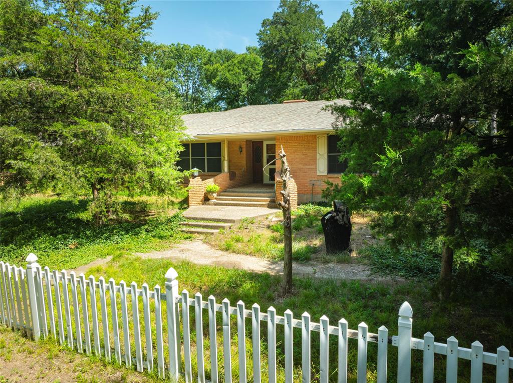 10289 County Road 578 Blue Ridge, TX 75424 - Photo 7 of 39 a front view of house with yard and green space