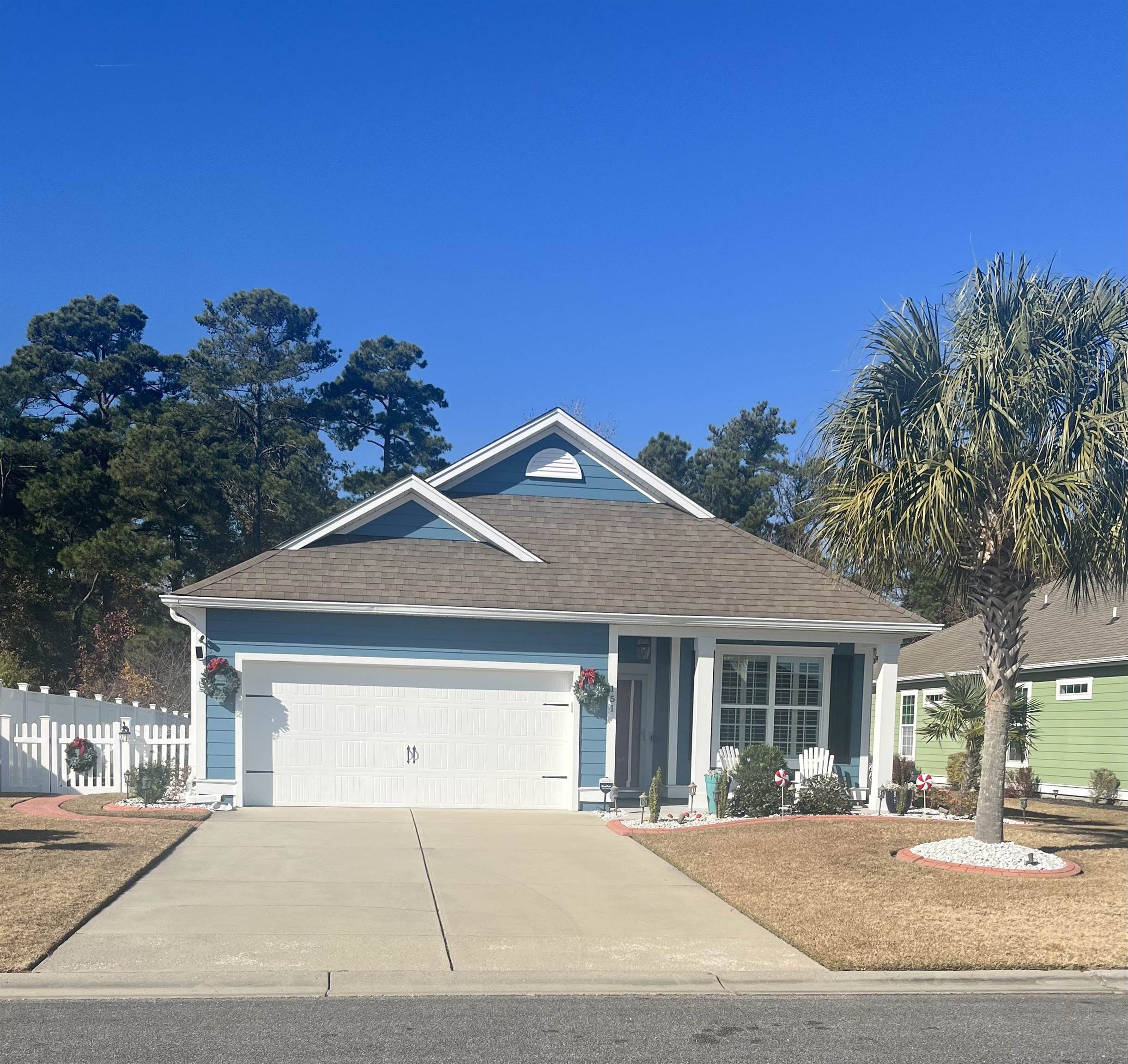 151 Coral Beach Circle Myrtle Beach, SC 29575 - Photo 1 of 40 Ranch-style home featuring driveway, a garage, and a shingled roof