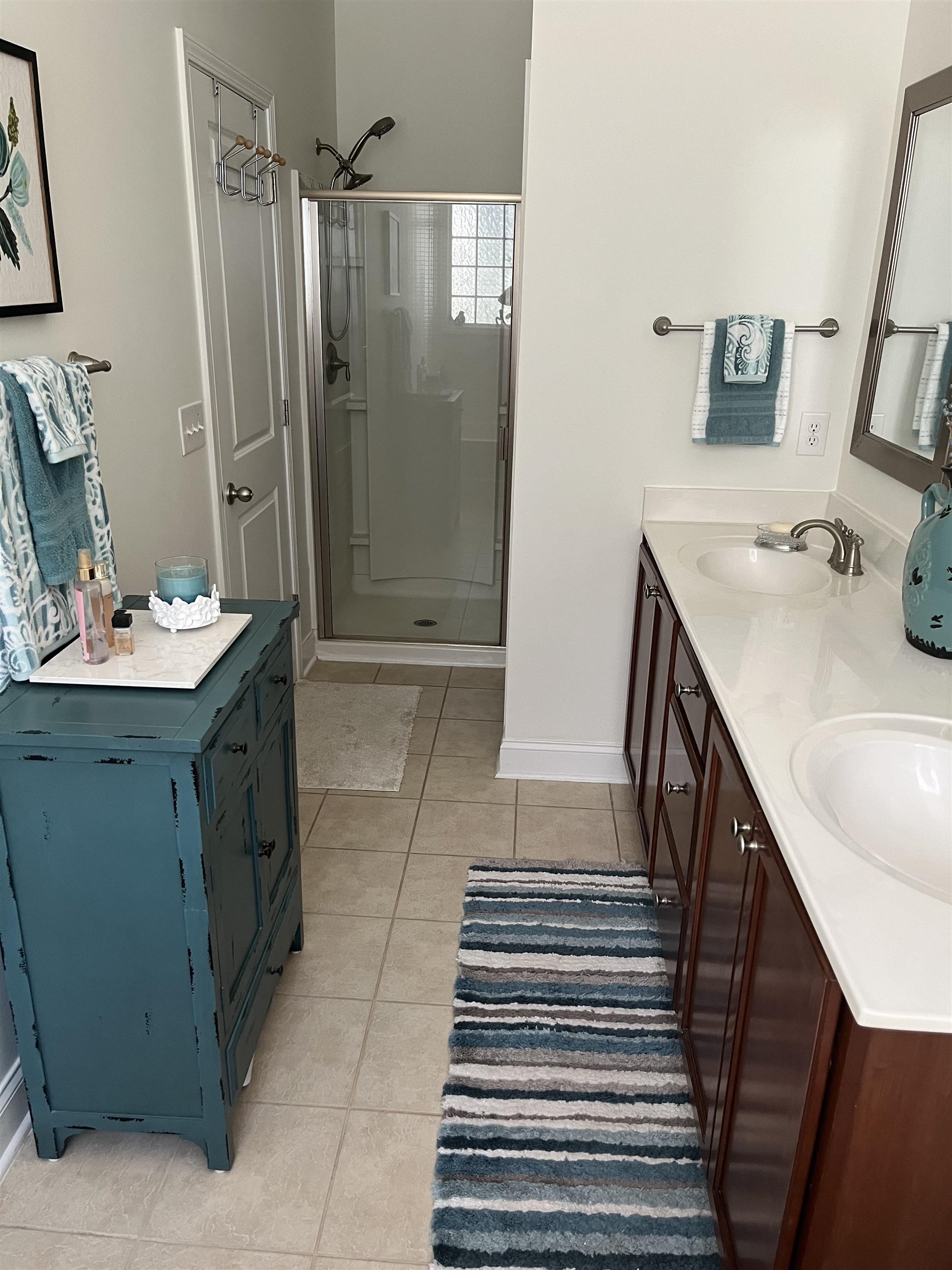151 Coral Beach Circle Myrtle Beach, SC 29575 - Photo 19 of 40 Full bathroom with double vanity, light tile patterned flooring, and a stall shower