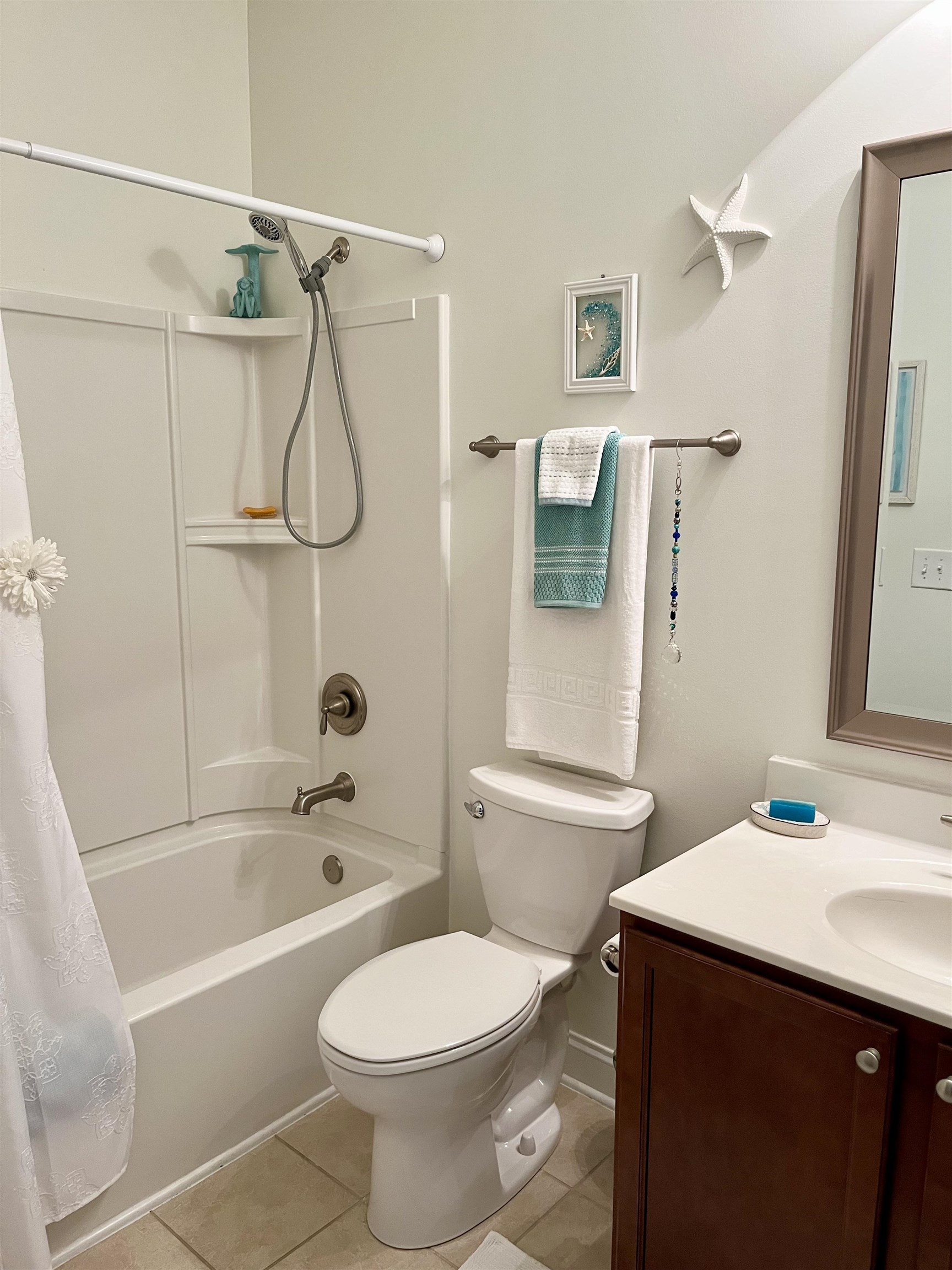 151 Coral Beach Circle Myrtle Beach, SC 29575 - Photo 26 of 40 Full bathroom featuring shower / bath combo, vanity, and light tile patterned floors