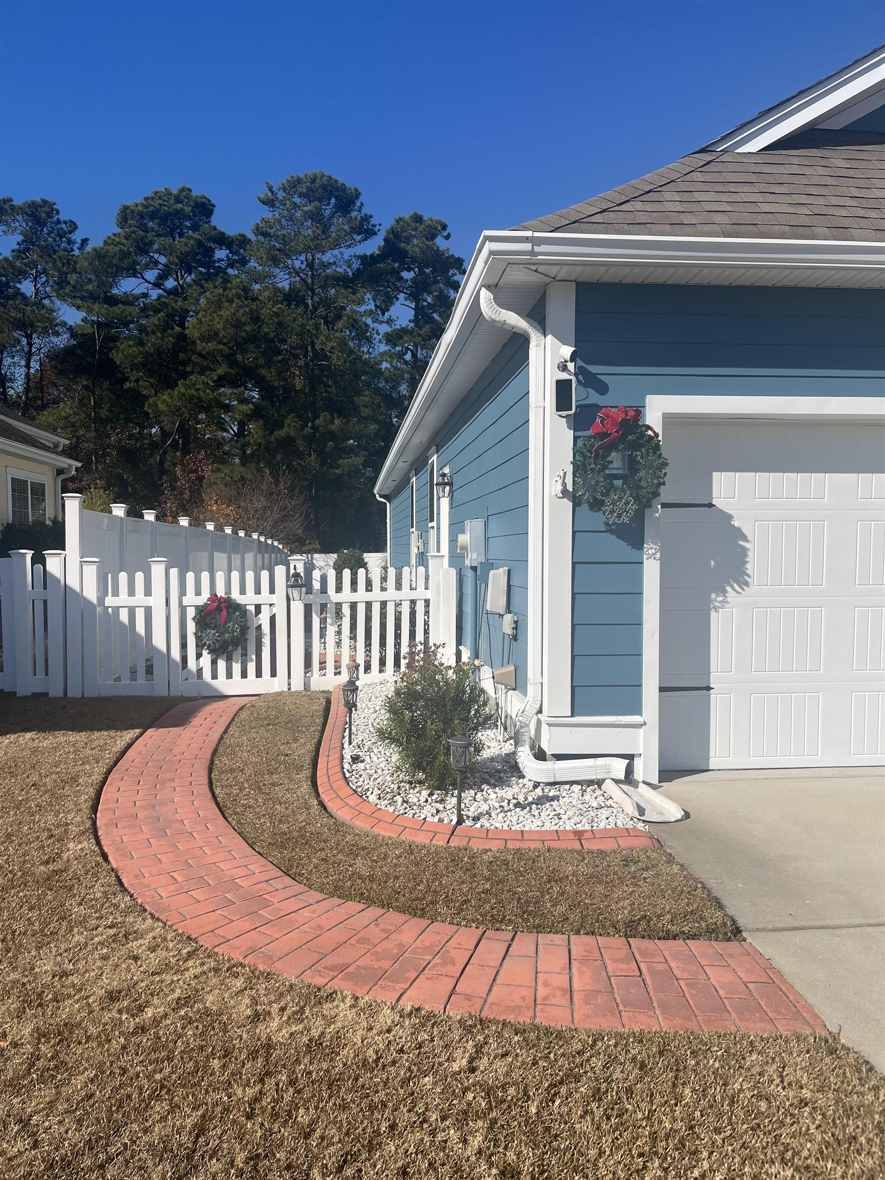 151 Coral Beach Circle Myrtle Beach, SC 29575 - Photo 3 of 40 View of property exterior featuring a garage and concrete driveway