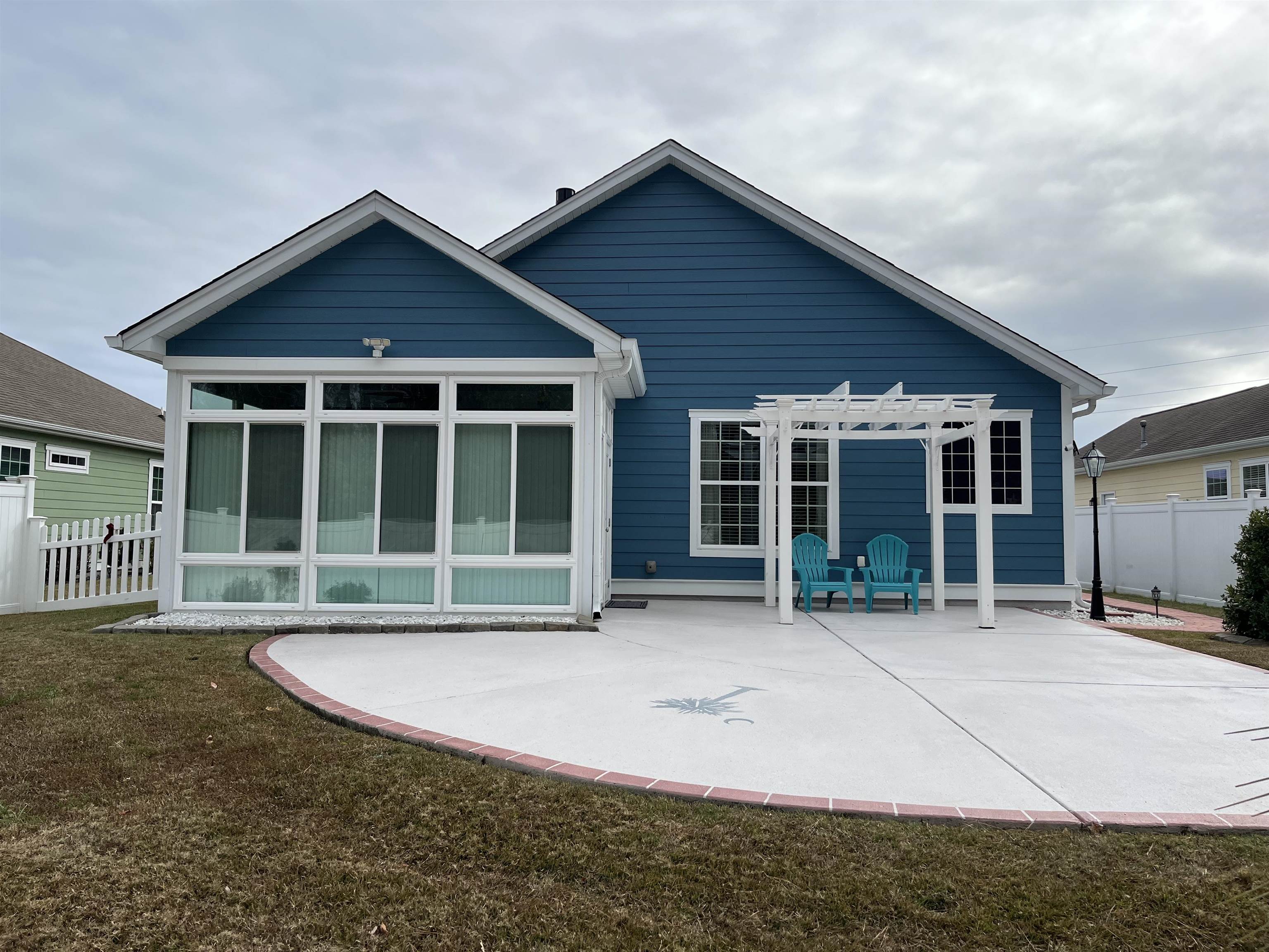 151 Coral Beach Circle Myrtle Beach, SC 29575 - Photo 35 of 40 Rear view of property featuring a pergola and a patio area