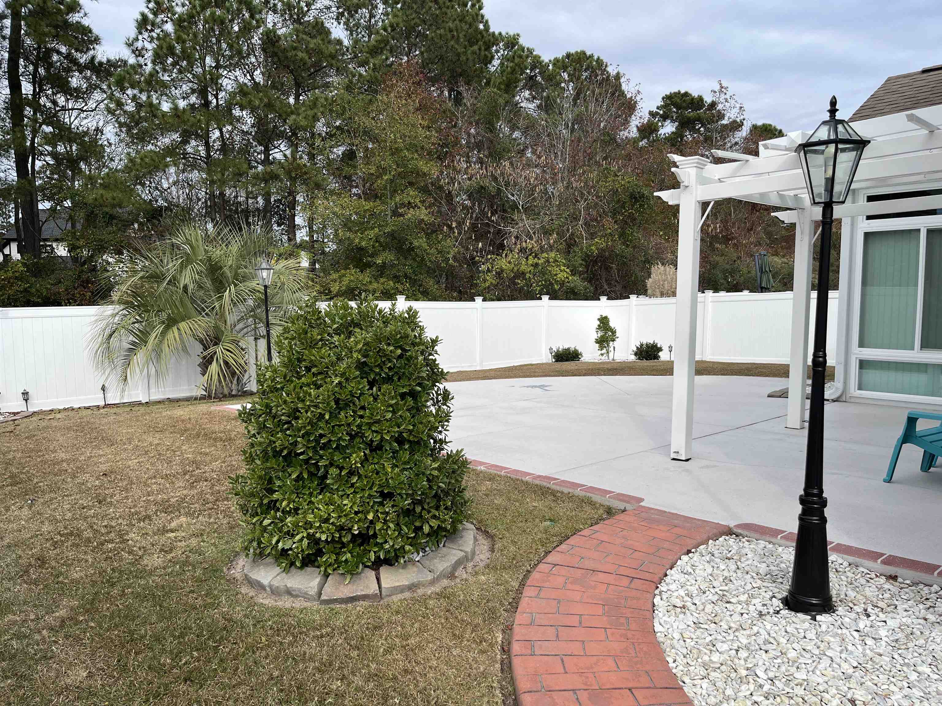 151 Coral Beach Circle Myrtle Beach, SC 29575 - Photo 36 of 40 Fenced backyard with a patio and a pergola