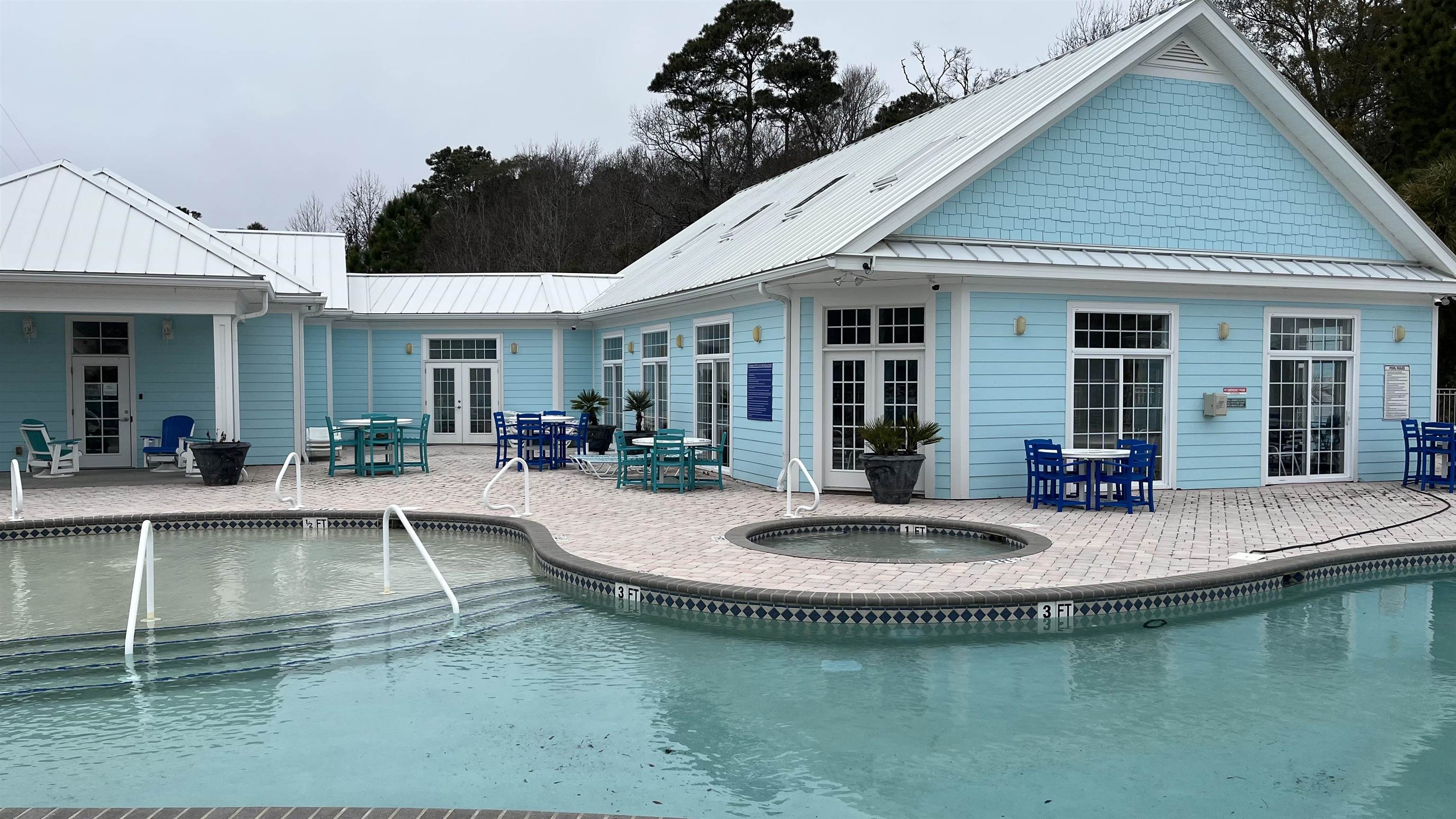 151 Coral Beach Circle Myrtle Beach, SC 29575 - Photo 39 of 40 Community pool with a patio, french doors, a community hot tub, and outdoor dining space