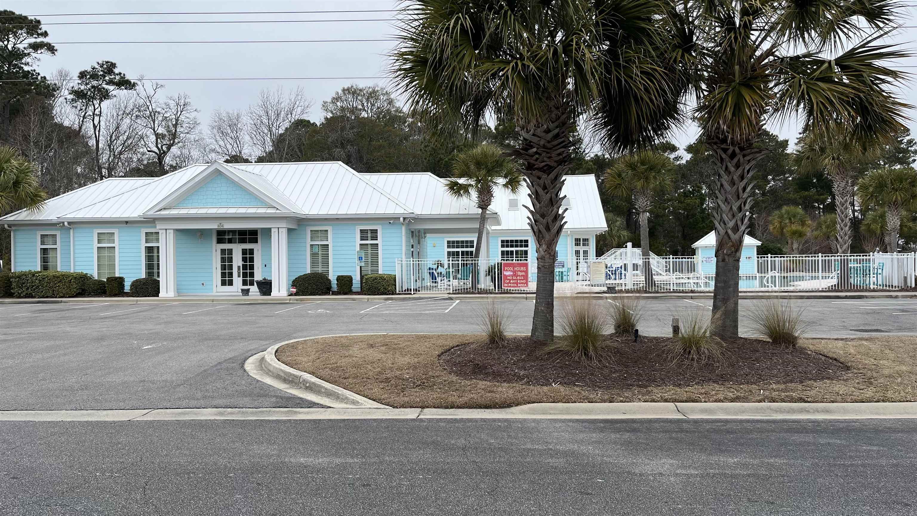 151 Coral Beach Circle Myrtle Beach, SC 29575 - Photo 40 of 40 View of building exterior featuring uncovered parking