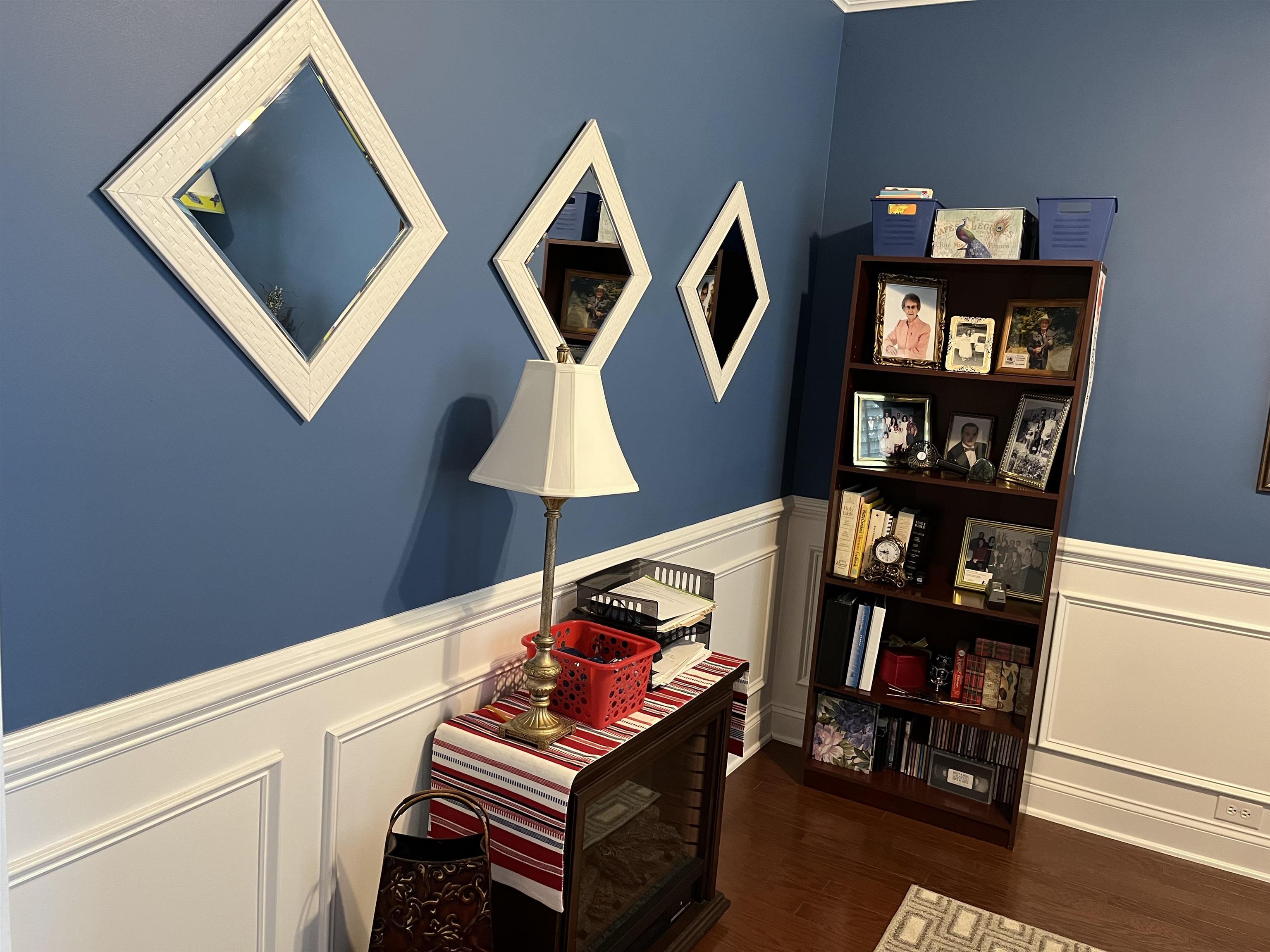 151 Coral Beach Circle Myrtle Beach, SC 29575 - Photo 7 of 40 Living area featuring wainscoting, a decorative wall, and dark wood-type flooring