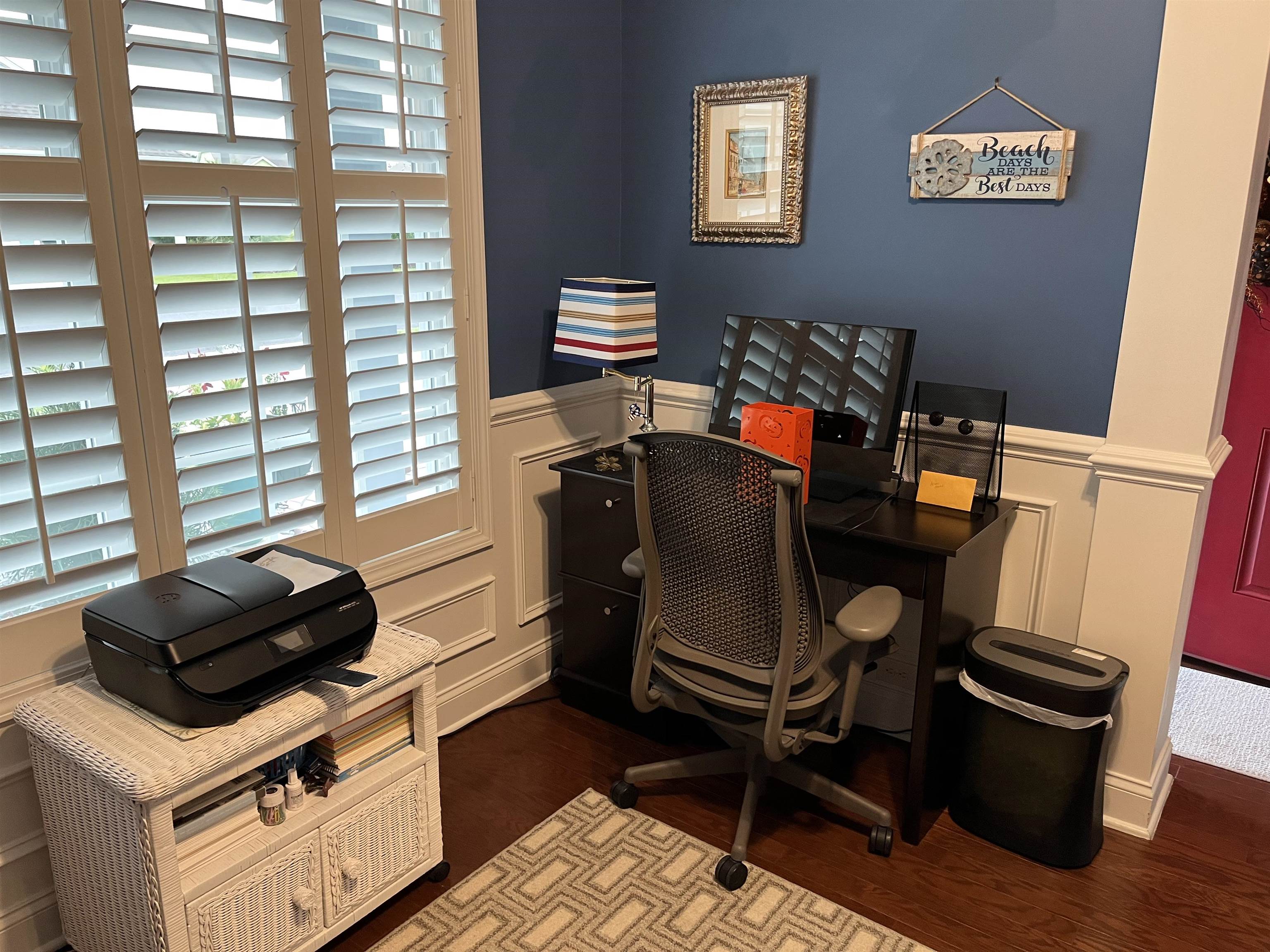151 Coral Beach Circle Myrtle Beach, SC 29575 - Photo 8 of 40 Home office featuring a decorative wall, a wainscoted wall, and dark wood finished floors