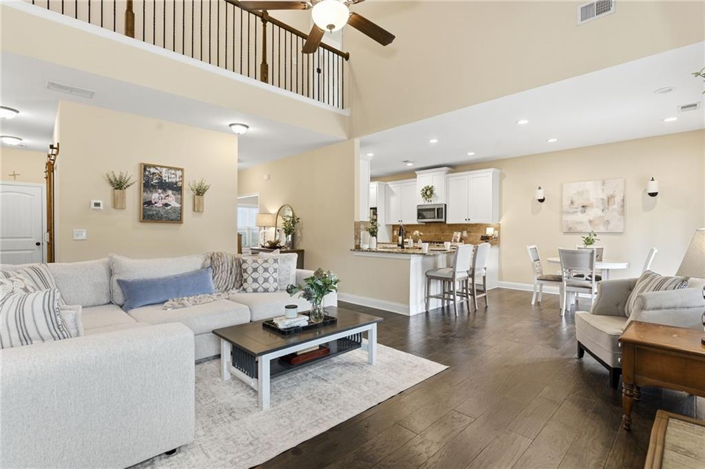 266 Cobblestone Trail Dallas, GA 30132 - Photo 15 of 49 a living room with furniture kitchen view and a wooden floor