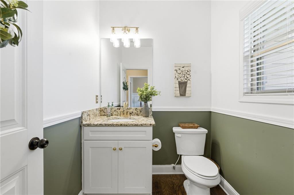 266 Cobblestone Trail Dallas, GA 30132 - Photo 16 of 49 a bathroom with a granite countertop toilet sink and mirror