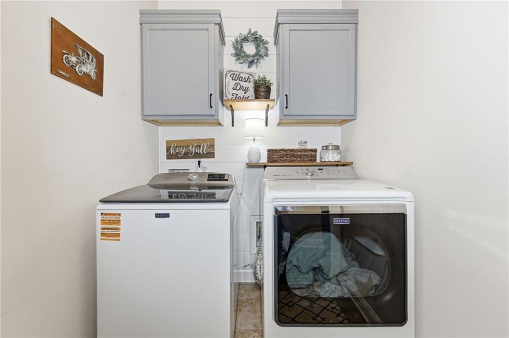 266 Cobblestone Trail Dallas, GA 30132 - Photo 27 of 49 a utility room with a sink a washer and dryer