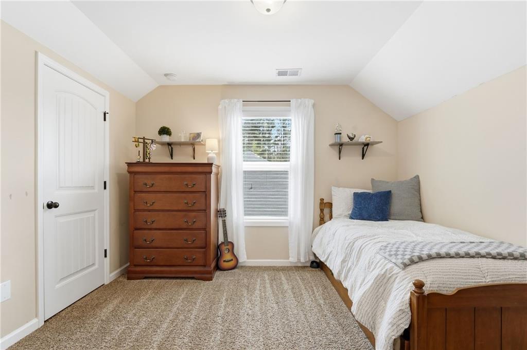 266 Cobblestone Trail Dallas, GA 30132 - Photo 29 of 49 a bedroom with a bed and a window