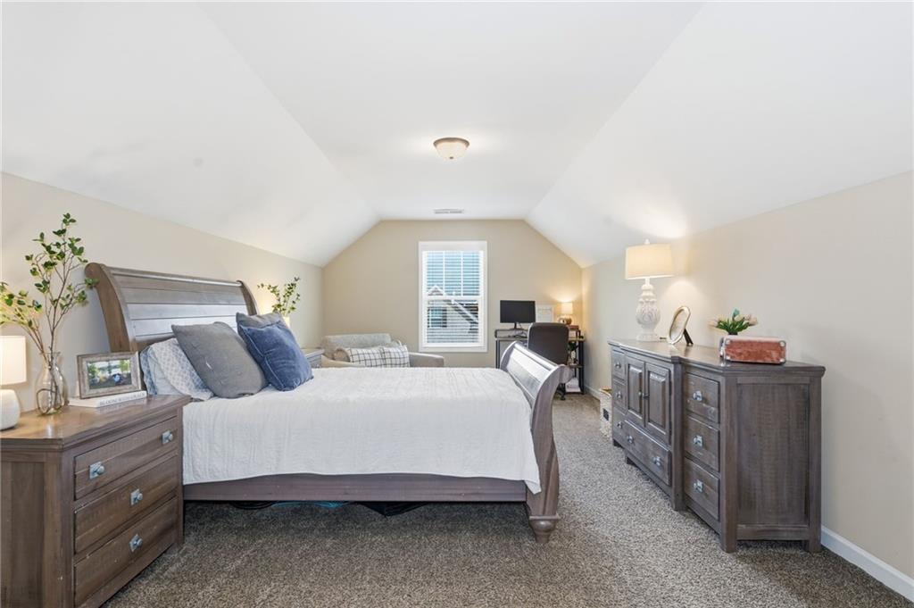 266 Cobblestone Trail Dallas, GA 30132 - Photo 33 of 49 a bedroom with a bed and dresser