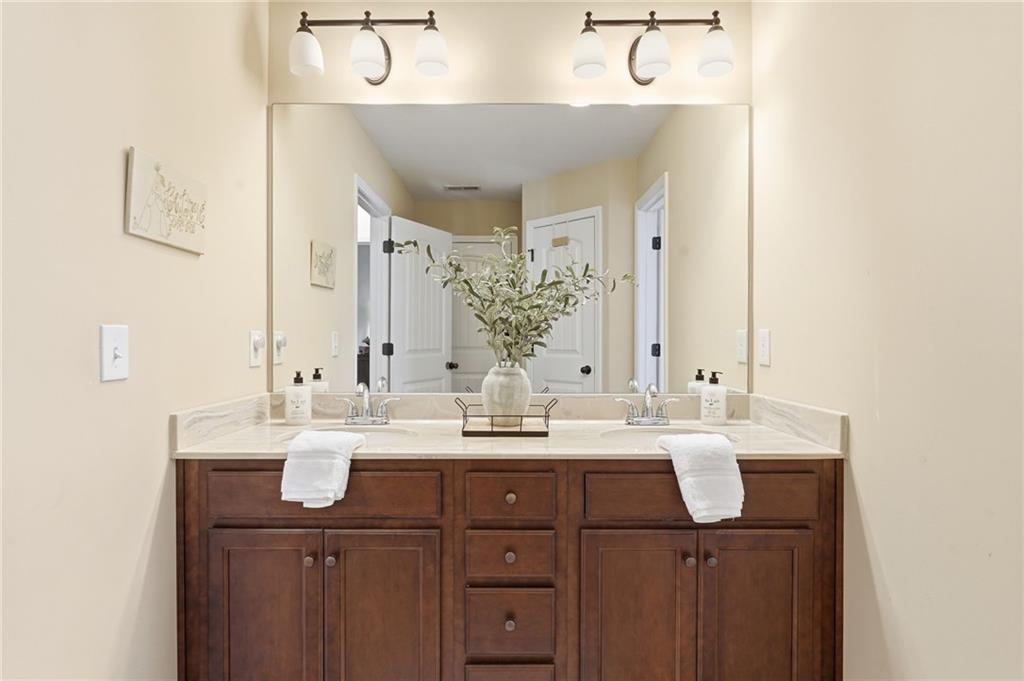 266 Cobblestone Trail Dallas, GA 30132 - Photo 36 of 49 a bathroom with a sink and a mirror